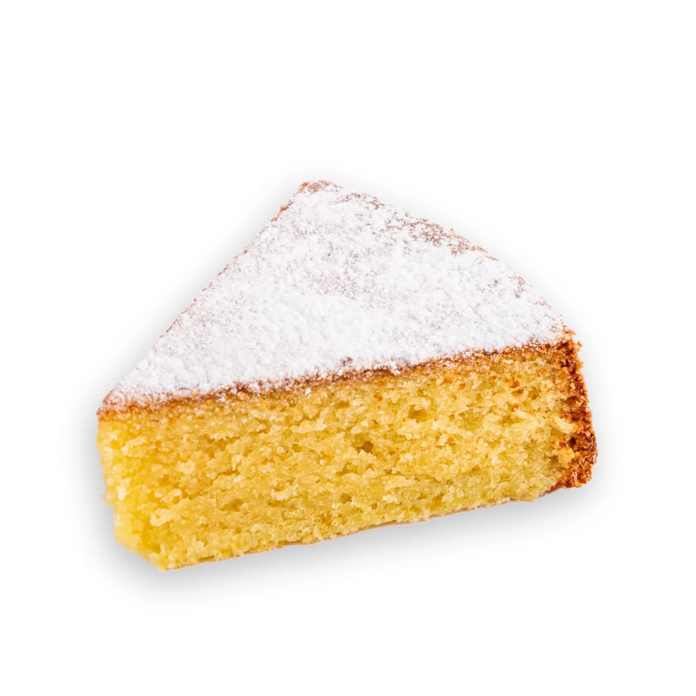Fetta di torta caprese al limone spolverata di zucchero a velo